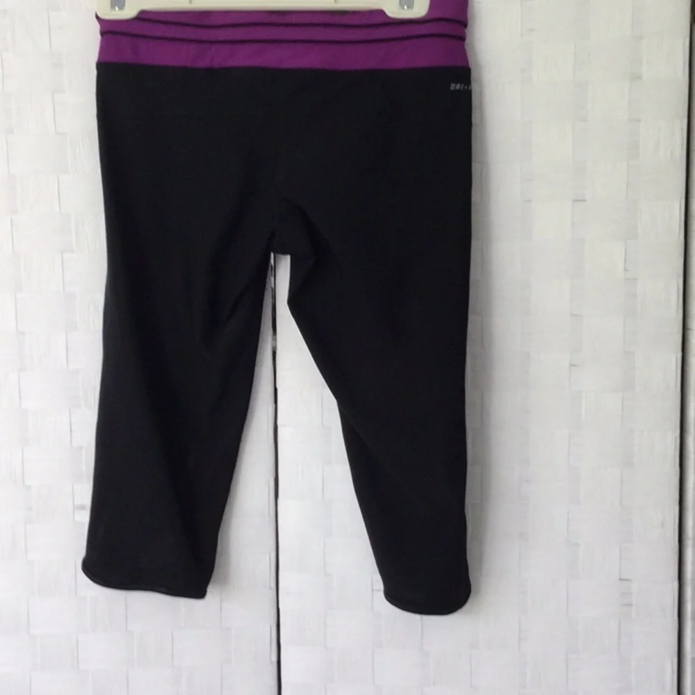 Woman’s Nike Running size M washable color black & purple.    #432